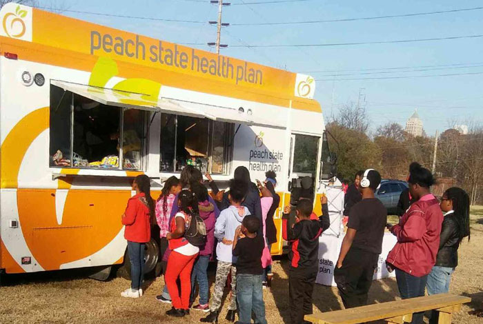 Residents standing in line for Mobile Market