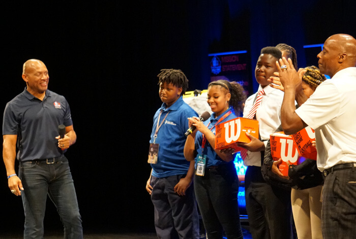 Aeneas Williams and Darrell Green interact with students on stage