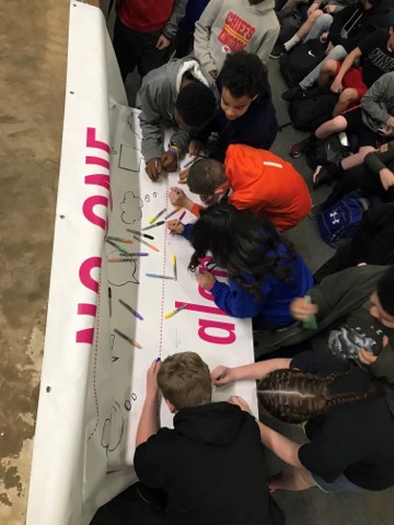 kids sign social isolation banner
